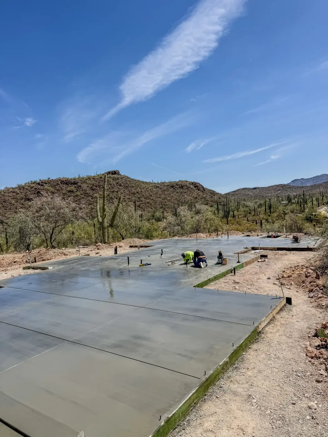 Large concrete slab poured by Raycrete against the Tucson mountains